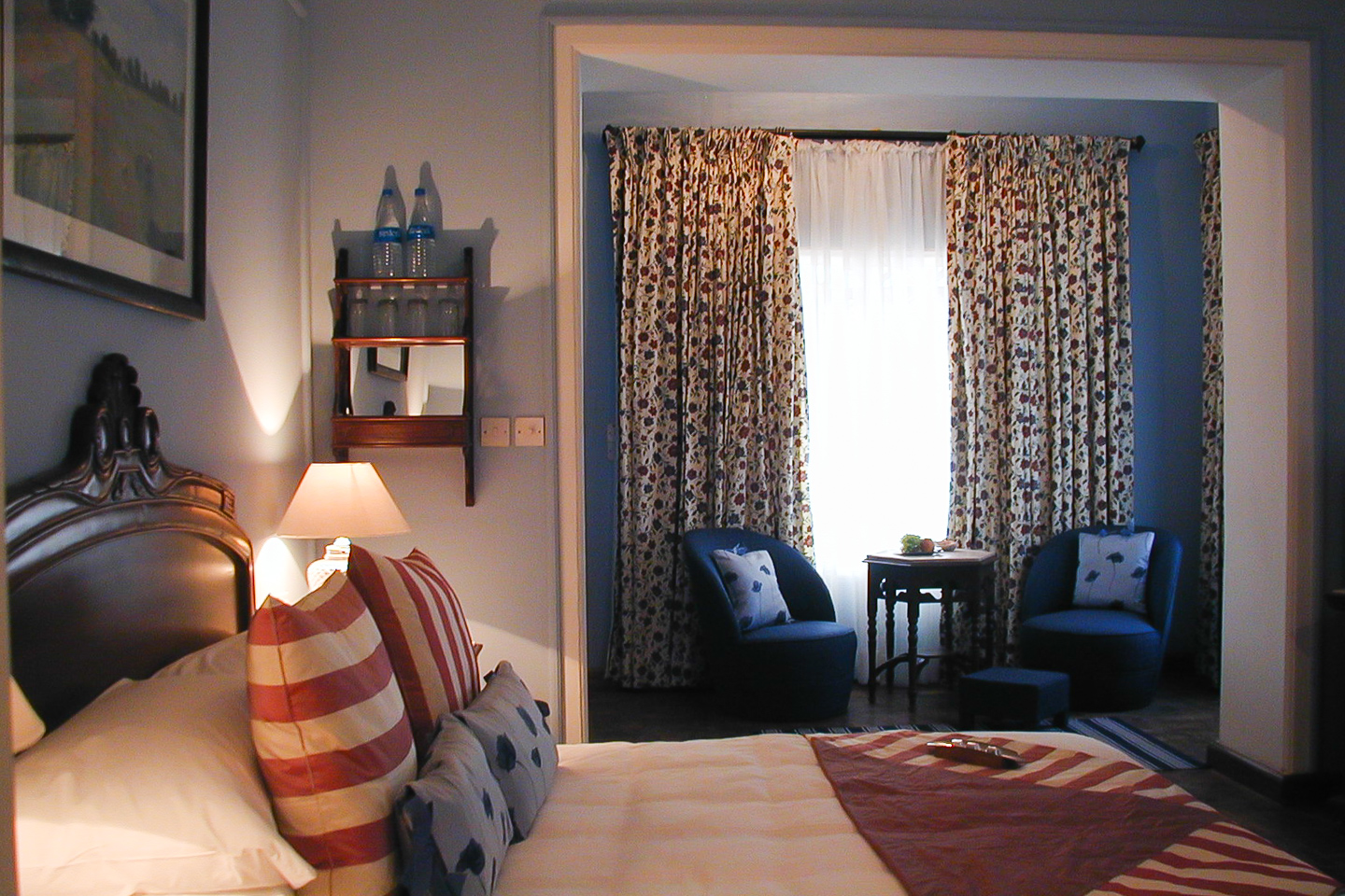 The blue guest room has pale blue walls with white highlights.