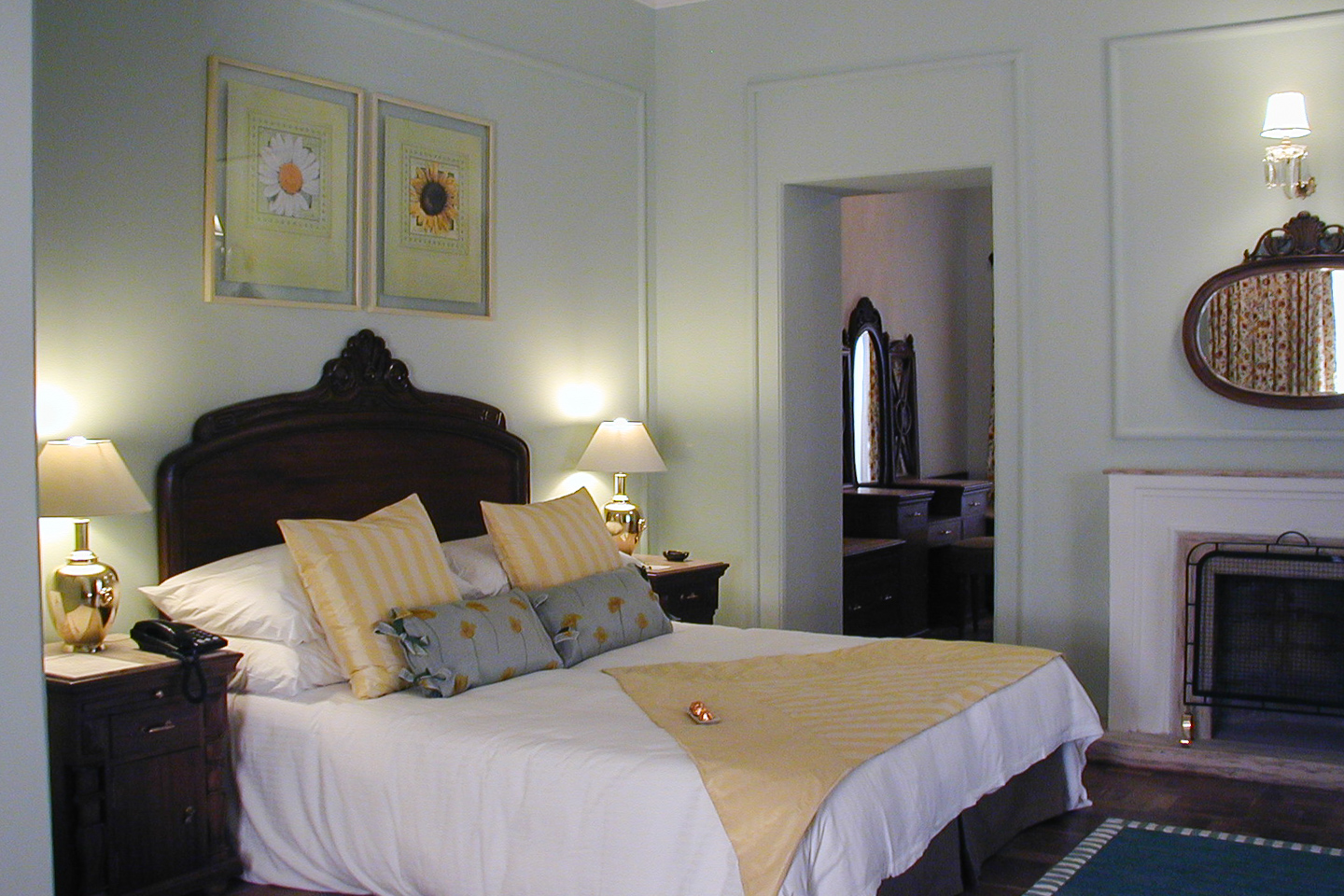 The green guest room has pale green walls with white highlights.