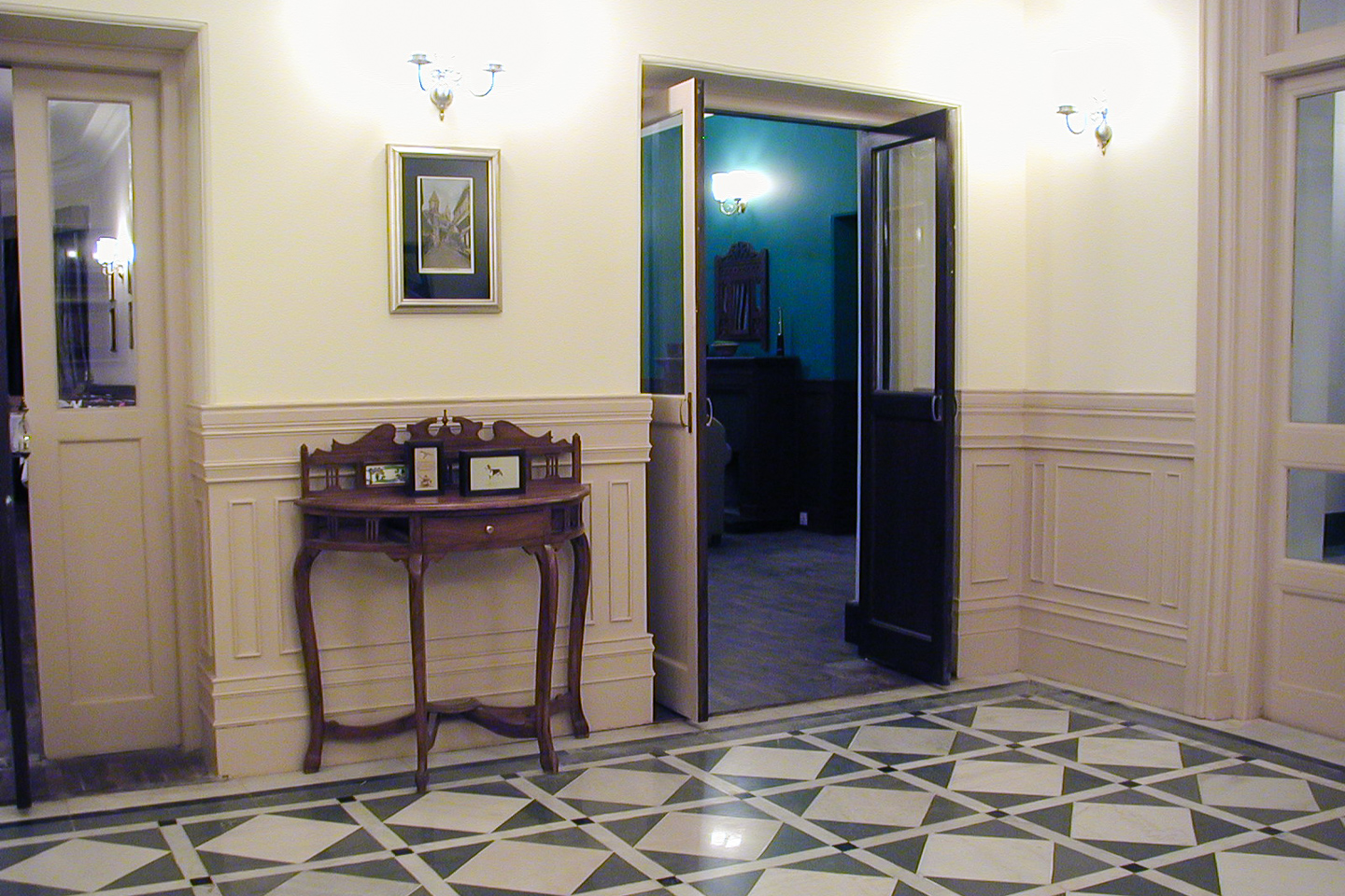 The rear lobby, with doors leading to the dining room, library and rear veranda.