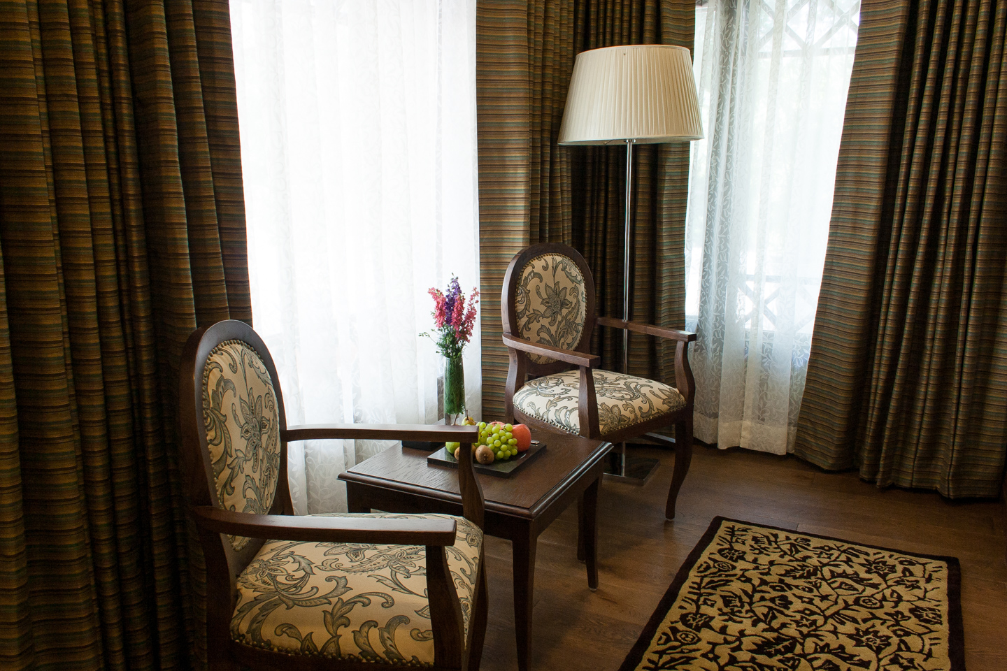 Chairs in front of the courtyard window.